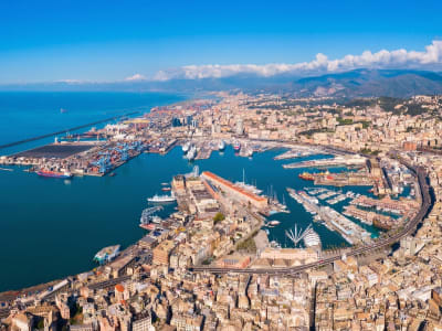 Aerial view of Genoa port with container terminal city and mountain backdrop Liguria Italy