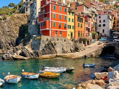 Riomaggiore Cinque Terre waterfront with traditional painted houses and fishing boats Liguria Italy