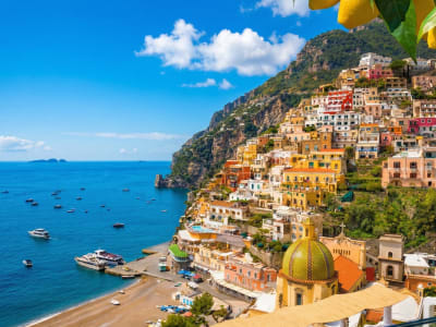 Positano Amalfi Coast aerial view with lemon trees colorful village and turquoise bay Italy