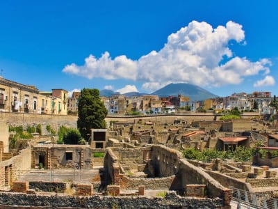 Herculaneum UNESCO ruins with ancient buildings and Mount Vesuvius and Naples behind Campania Italy