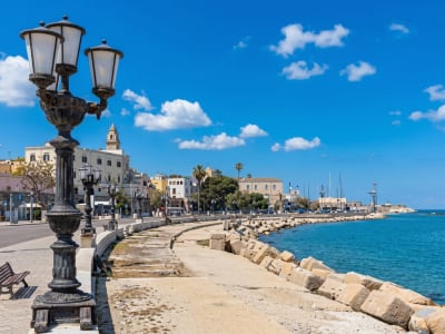 Bari seafront promenade with ornate street lamps and the Adriatic Sea on a sunny day