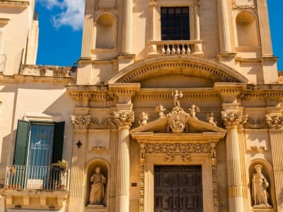 Ornate Baroque facade of Santa Croce basilica with detailed stone carvings in Lecce, Italy
