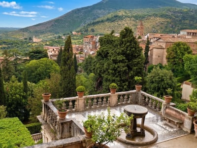 Panoramic view over the terraced gardens of Villa d'Este towards the hills of Tivoli, Lazio, Italy