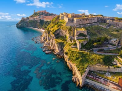 Aerial view of the Forte Stella hilltop fortress surrounded by sea on the island of Elba, Tuscany