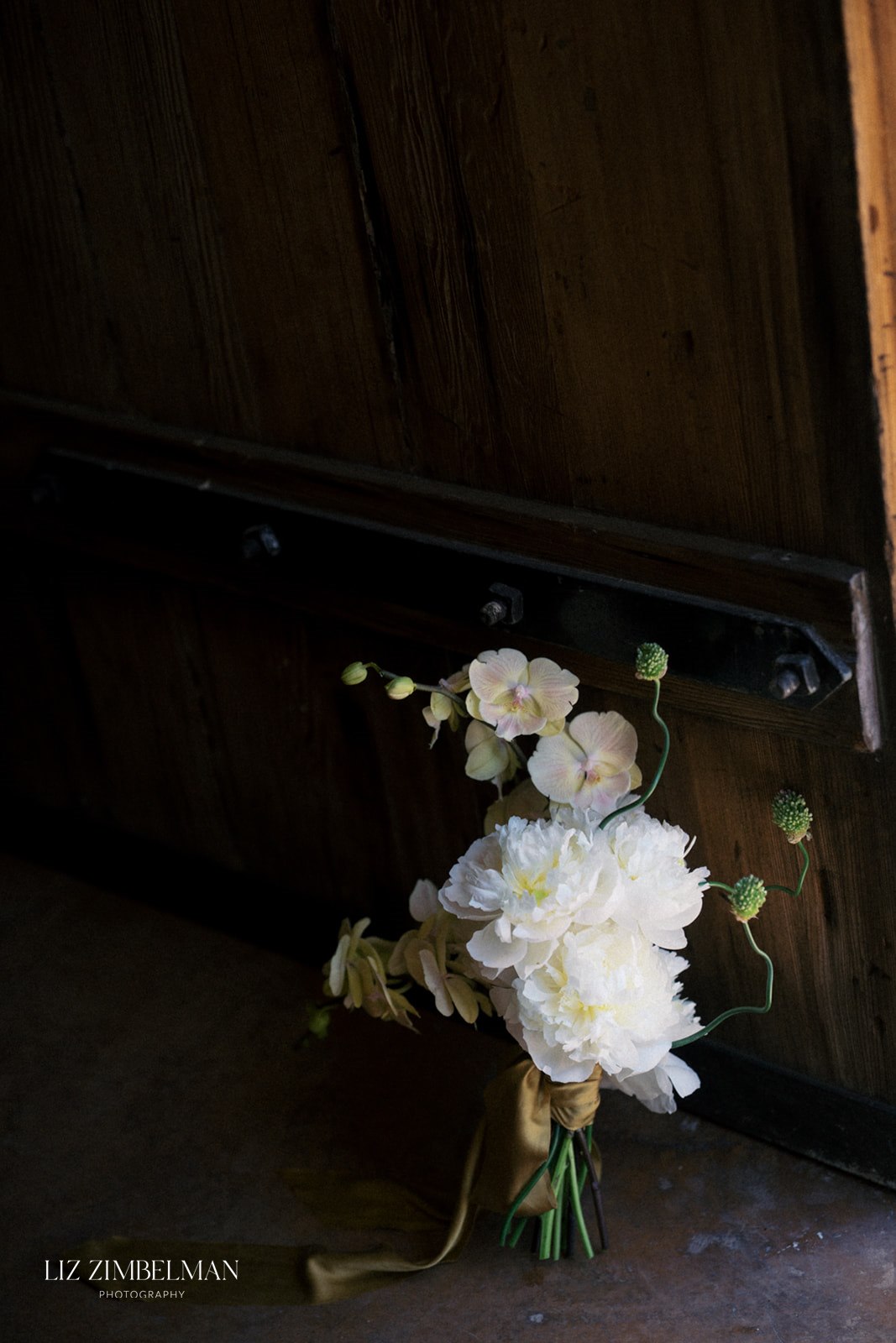 Bridal bouquet against barn door