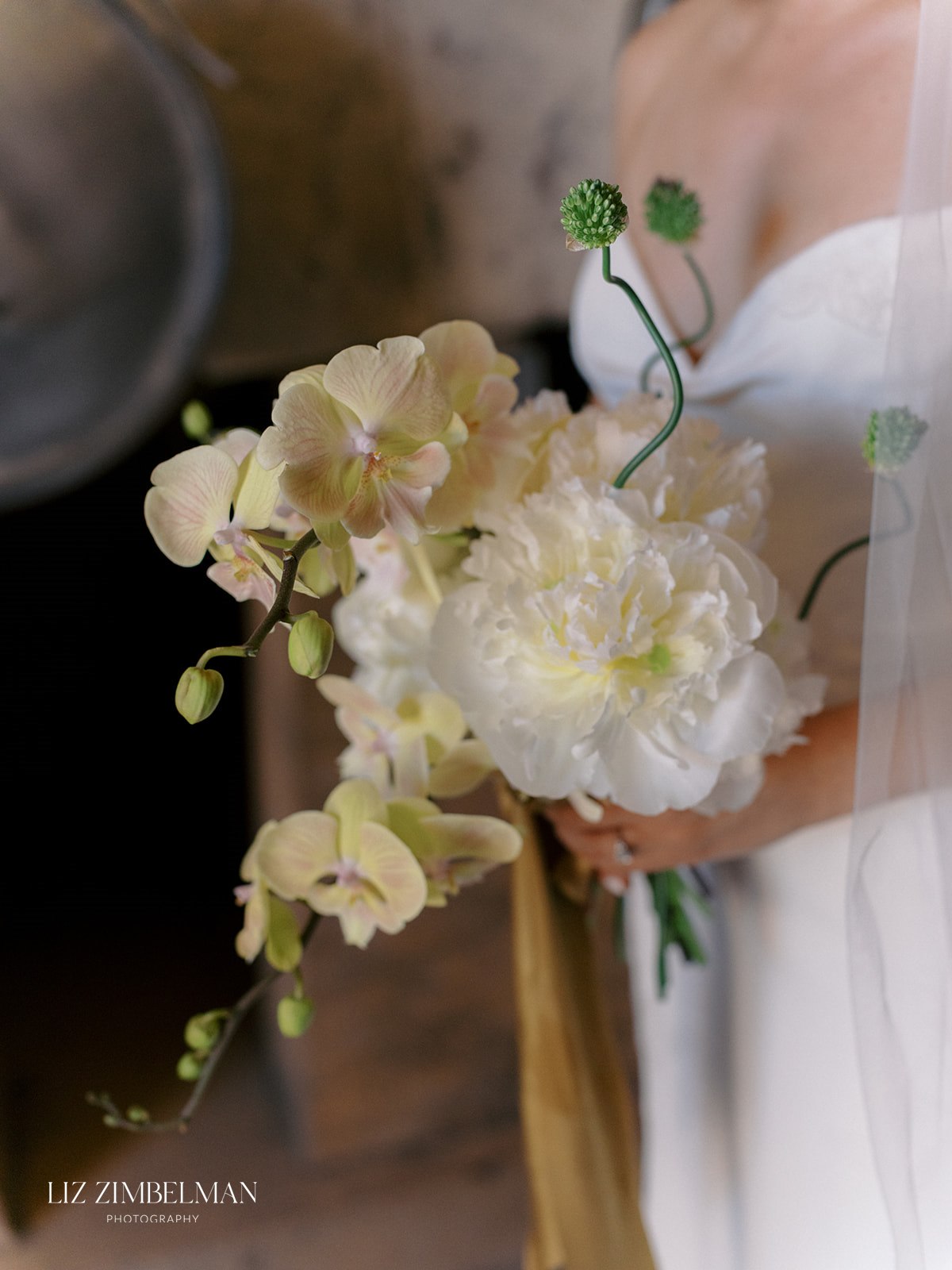 Bridal bouquet close-up with orchids and peonies