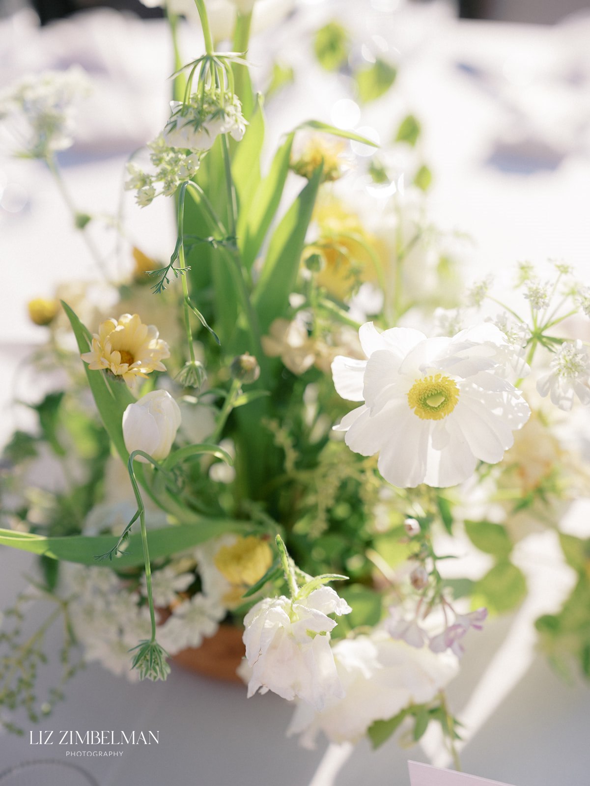 Floral centerpiece detail with cosmos and sweet peas