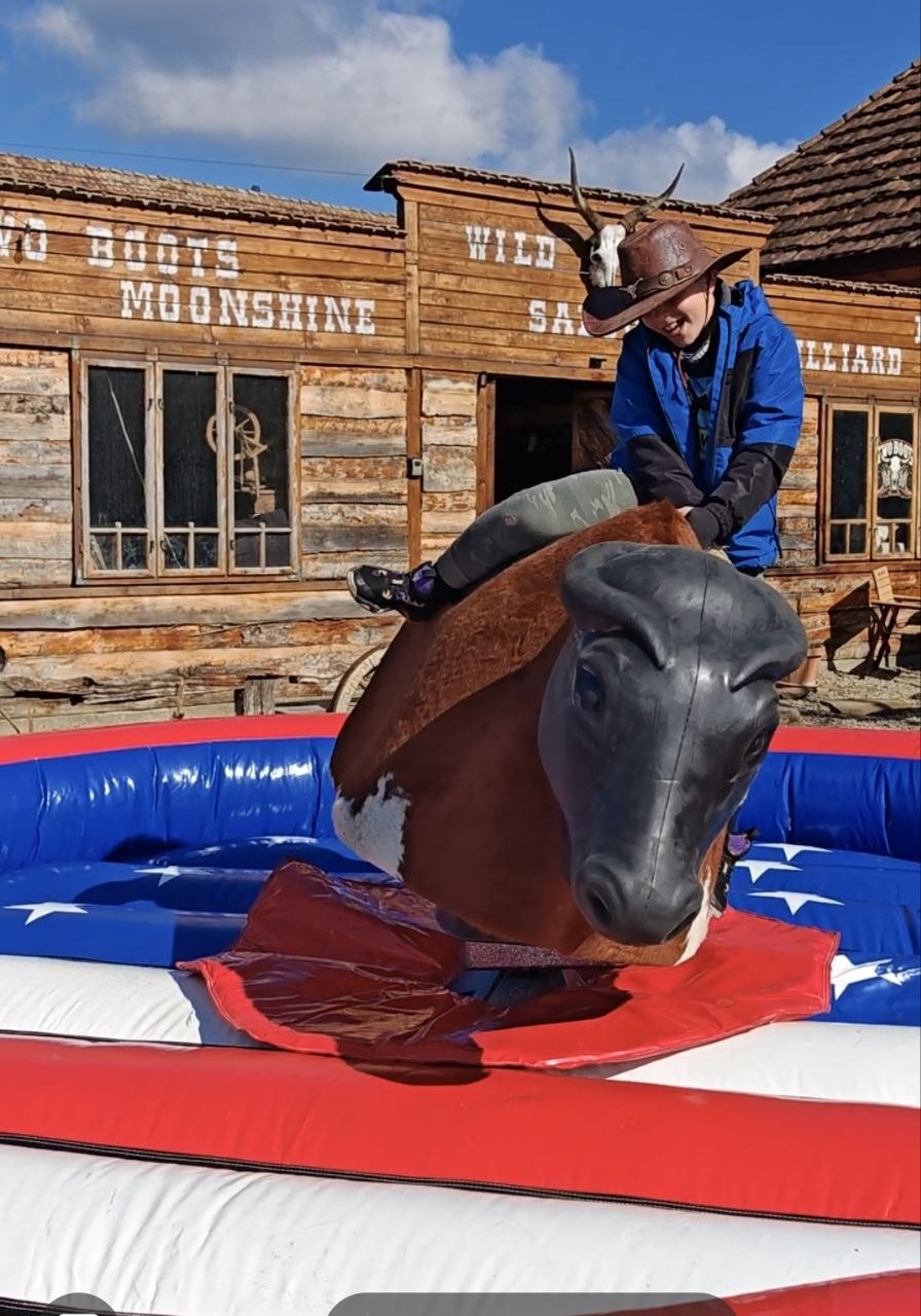 First kids testing the mechanical bull at Two Boots Ranch