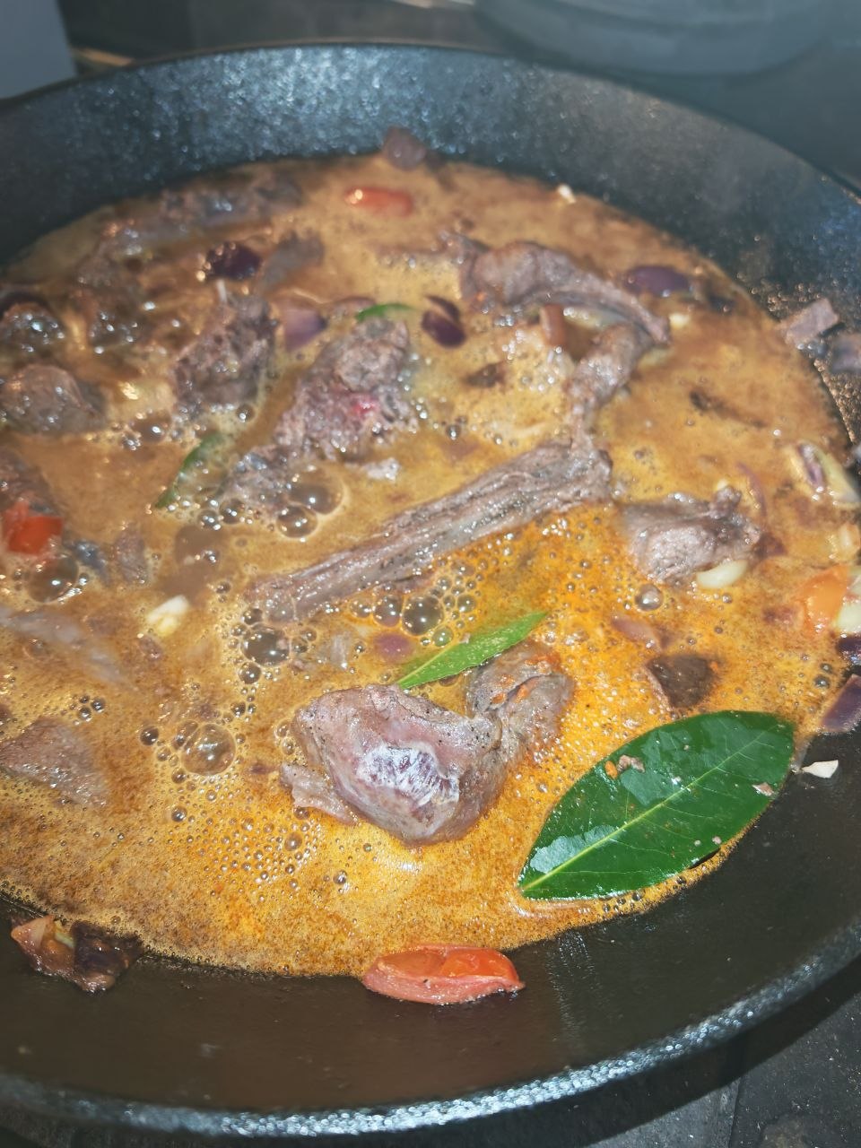 Wild rabbit stew simmering in the wok