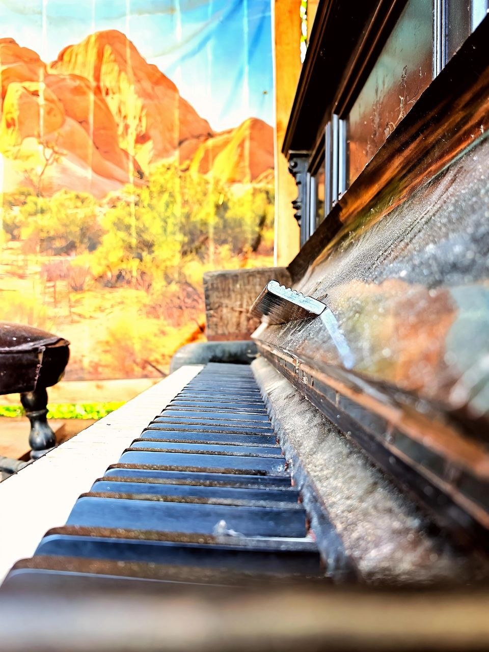 A real piano and Western wall detail at Two Boots Ranch