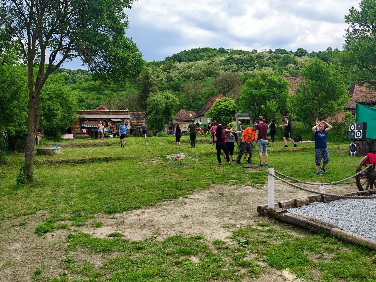 Guests enjoying outdoor activities on the grass during the company sports day at Two Boots Ranch