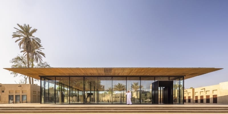 Transparent Glass Entrance Of Al Shindagha Museum, Providing A Glimpse Of The Captivating Exhibits Within.