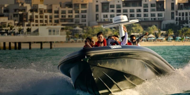 Passengers Enjoying The Speed Of The Black Boats As It Takes Off From Dubai Marina