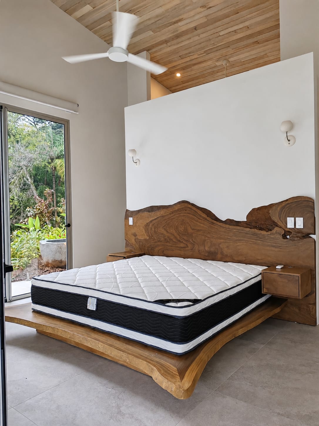 Primary bedroom and wood bed - Alas House (1)