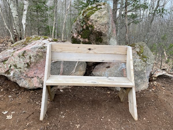 Disc golf hole bench