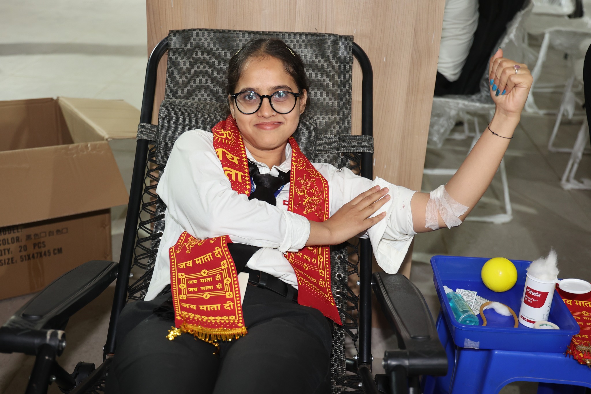 Donating blood during cimage blood donation camp