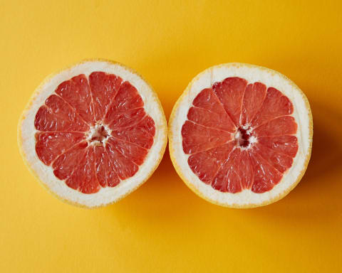 Cutting citrus on a sunny counter.