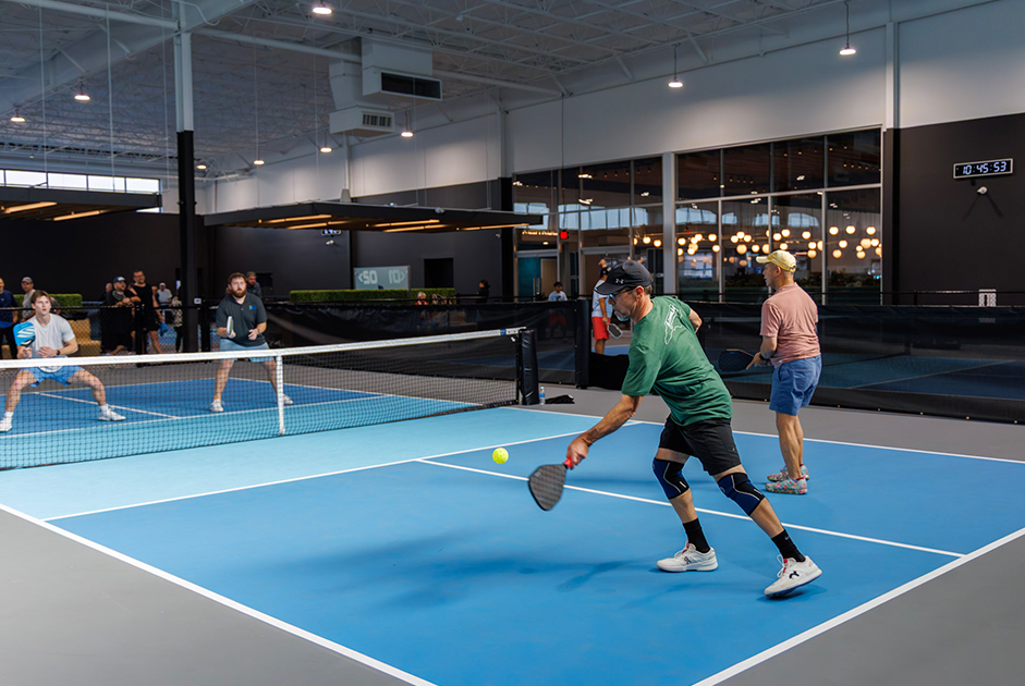 Indoor pickleball courts and dining at The Serve Pickleball and Kitchen in Cornelius North Carolina