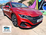 Side view of the 2021 Volkswagen Arteon R-Line Estate in Red