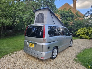 Side profile of Nissan Serena Highway Star campervan with pop top roof