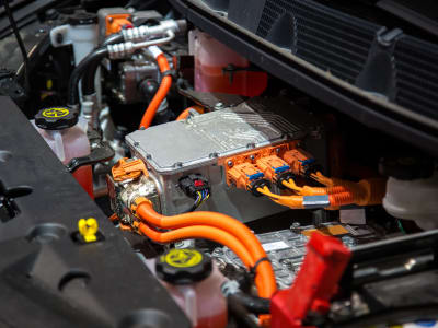 Electric vehicle engine bay with high-voltage components