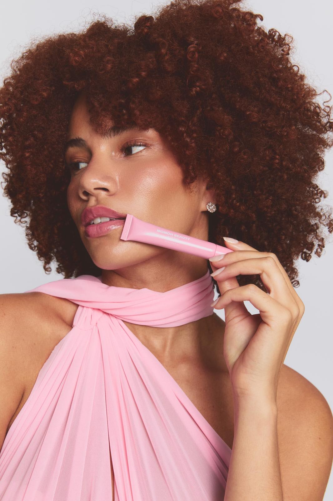 Model Holding Pink Phone Case to Face