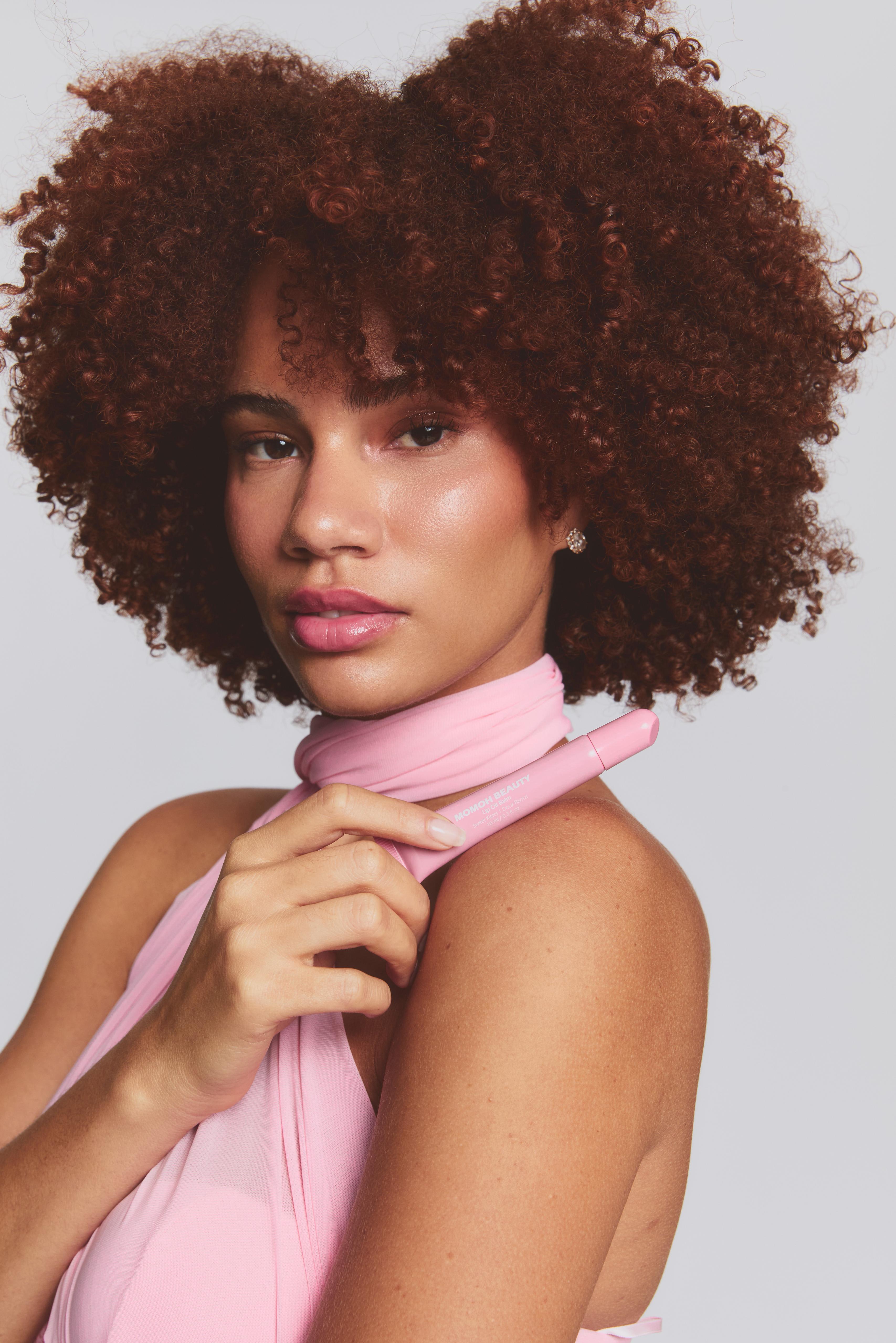 cake-me-lip-oil-balm_modelling-pink-scarf-shoulder