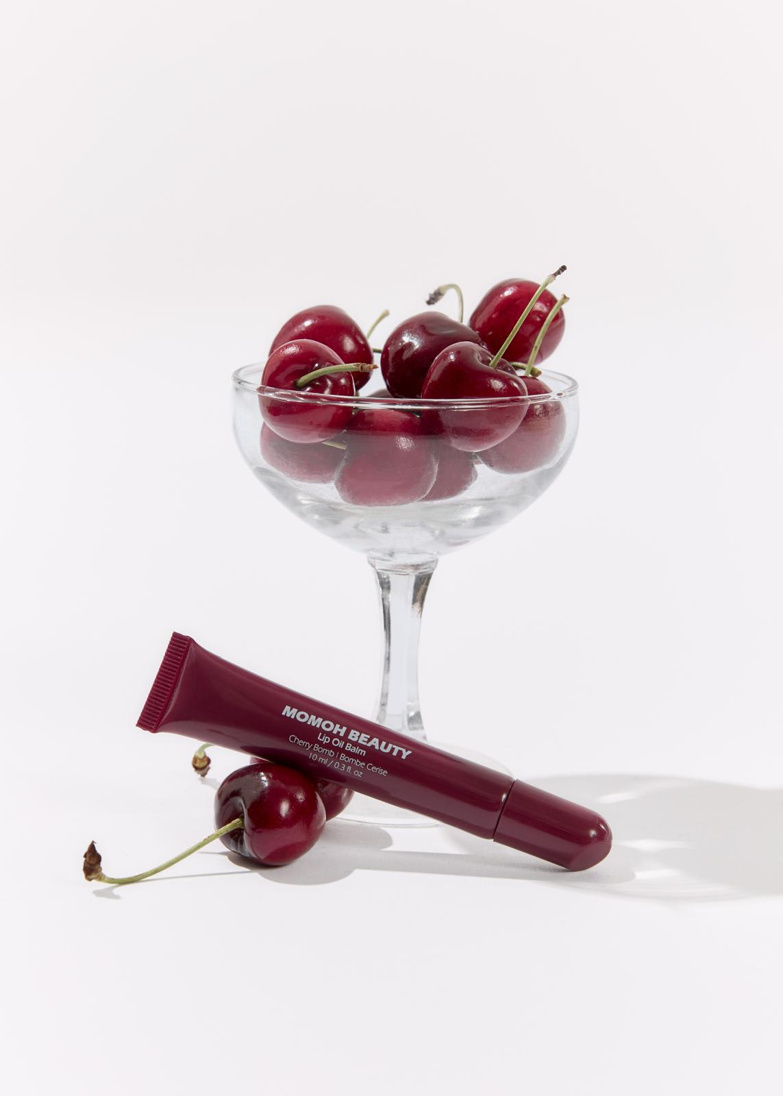 Hydrating Red Lip Oil Flatlay with Fresh Cherries