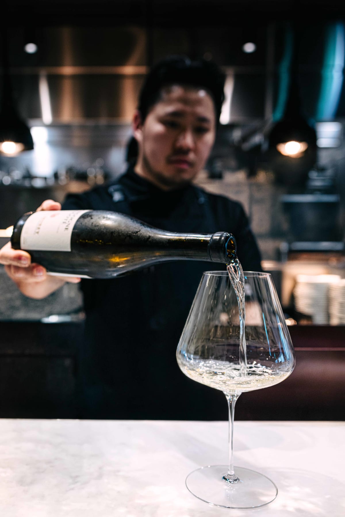 Bistronomy Notre, Seoul: a server pouring the Aligoté