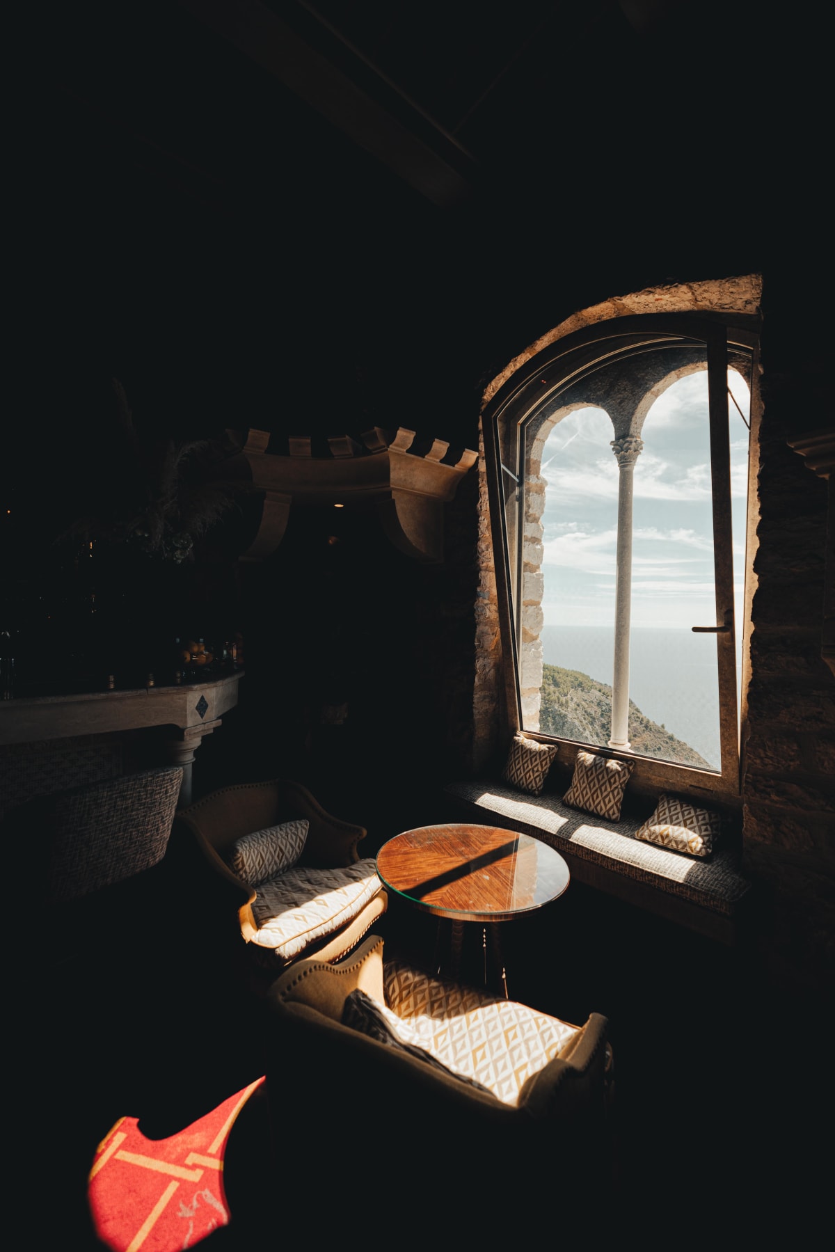 La Chèvre d'Or, Èze: the reception room with banners on the stone walls
