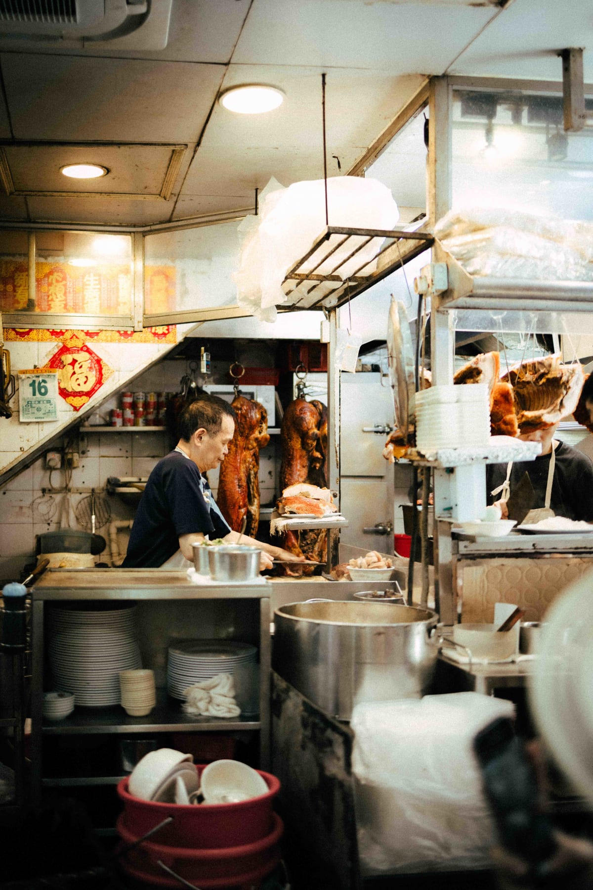 Joy Hing Roasted Meat, Hong Kong: a member of staff at work