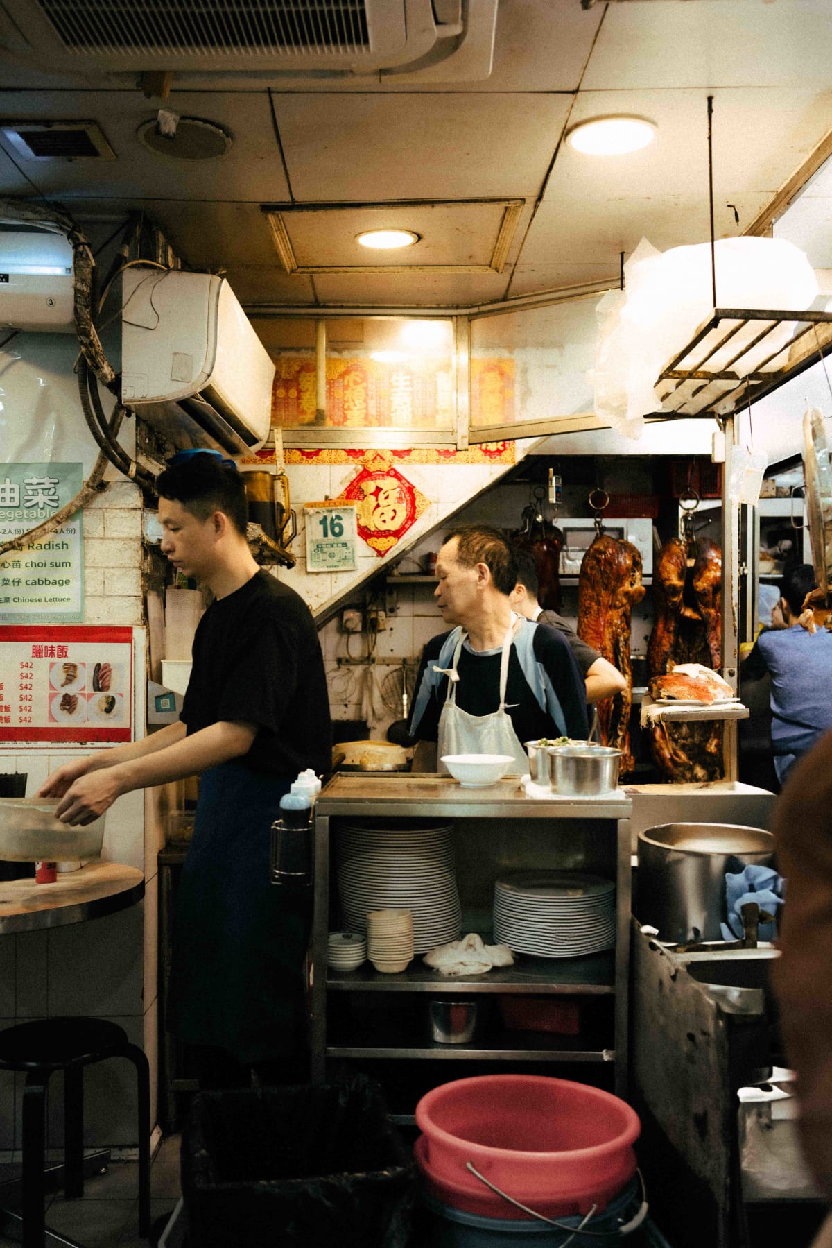 Joy Hing Roasted Meat, Hong Kong: a younger and an older cook working together