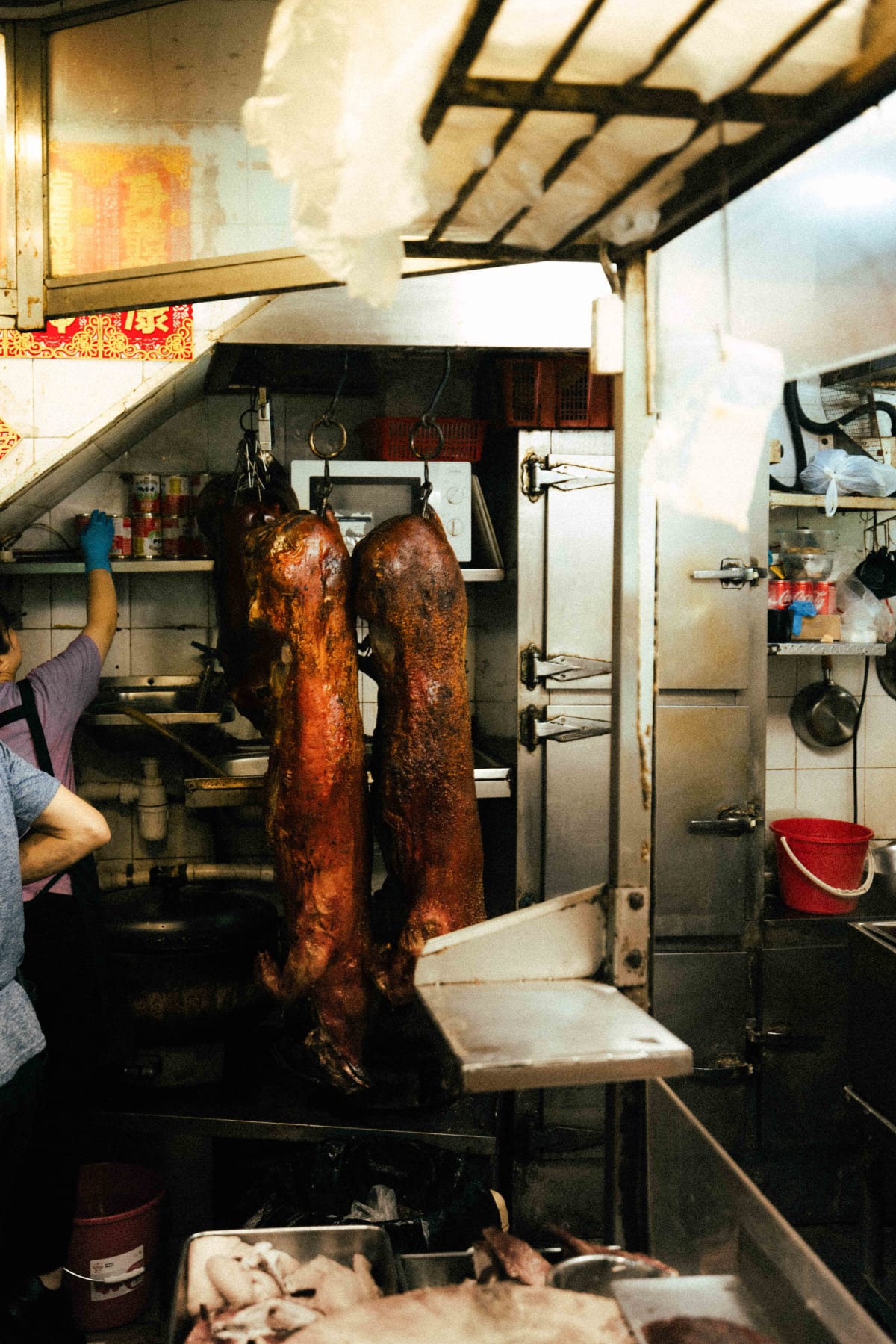 Joy Hing Roasted Meat, Hong Kong: a whole pig hanging at the back of the kitchen