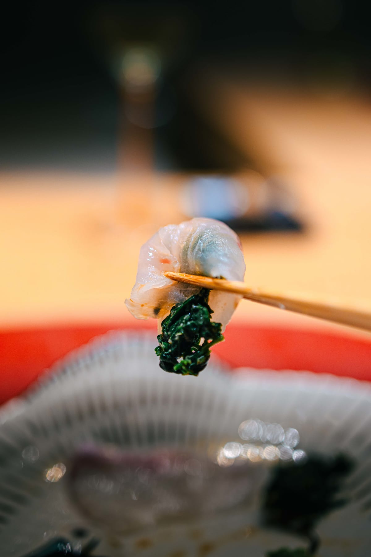 Mitou, Seoul: a slice of sashimi taken up with the garnishes