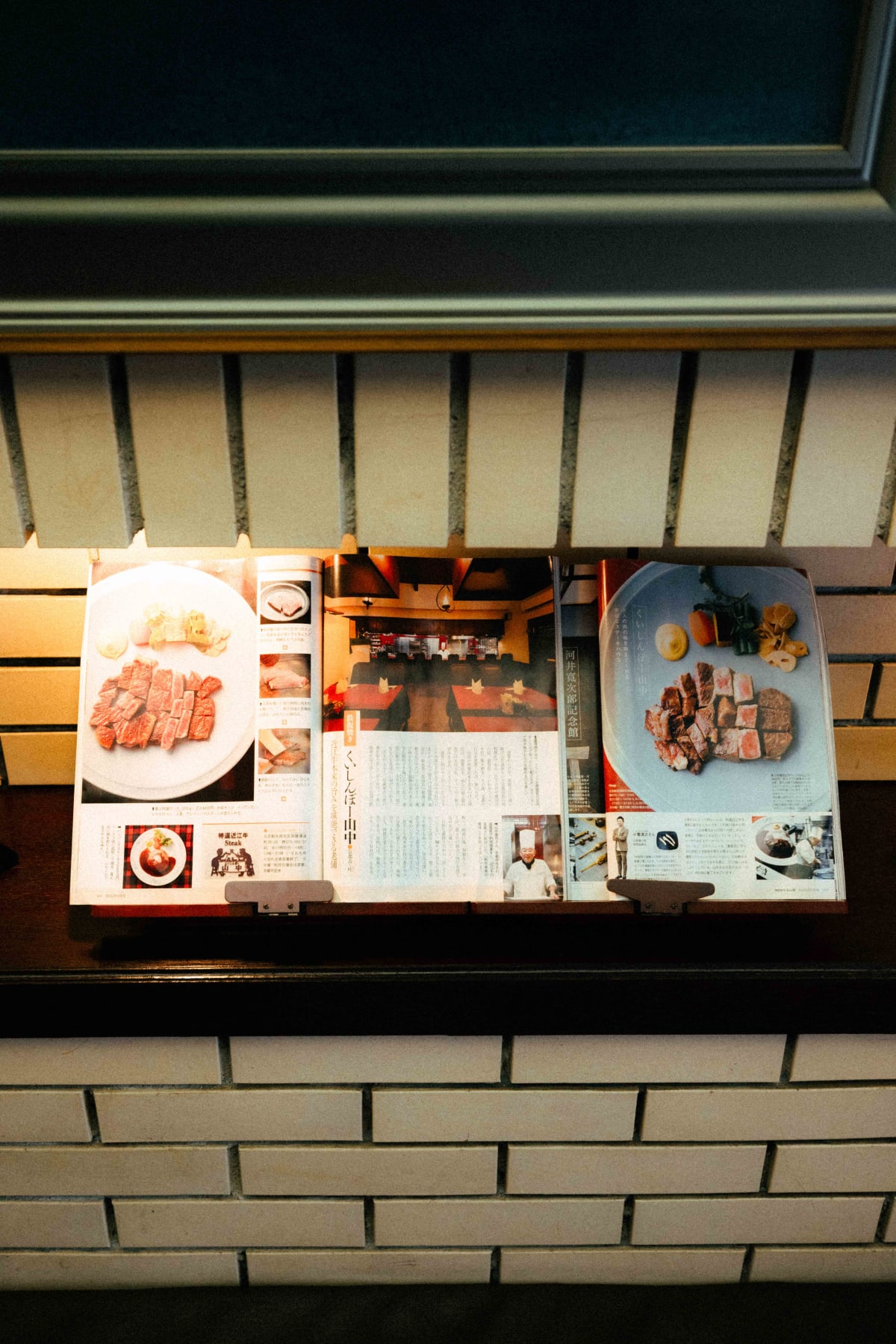 Kuishinbo Yamanaka, Kyoto: magazine features on the restaurant on display at the entrance