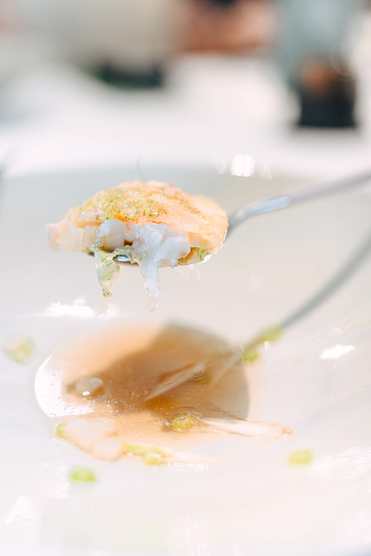 JEE, Hong Kong: the dumpling opened on a spoon, with the langoustine inside