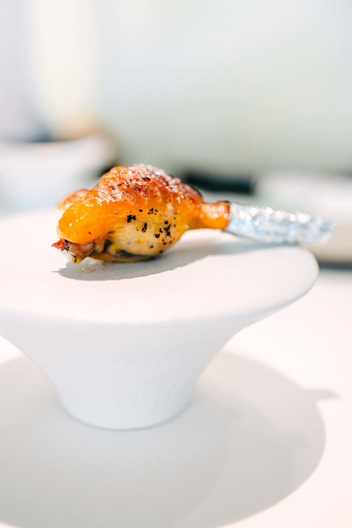 JEE, Hong Kong: the chicken wing from a low angle, with the whelk filling showing at the base