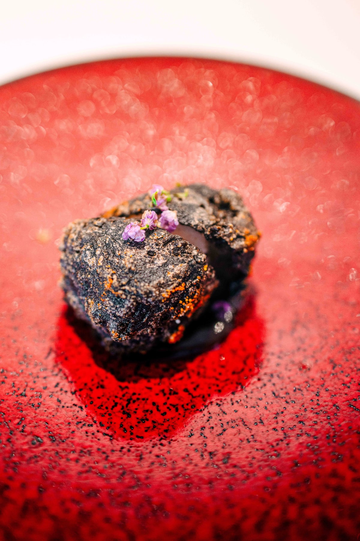 JEE, Hong Kong: the crispy sea cucumber up close, with small purple flowers