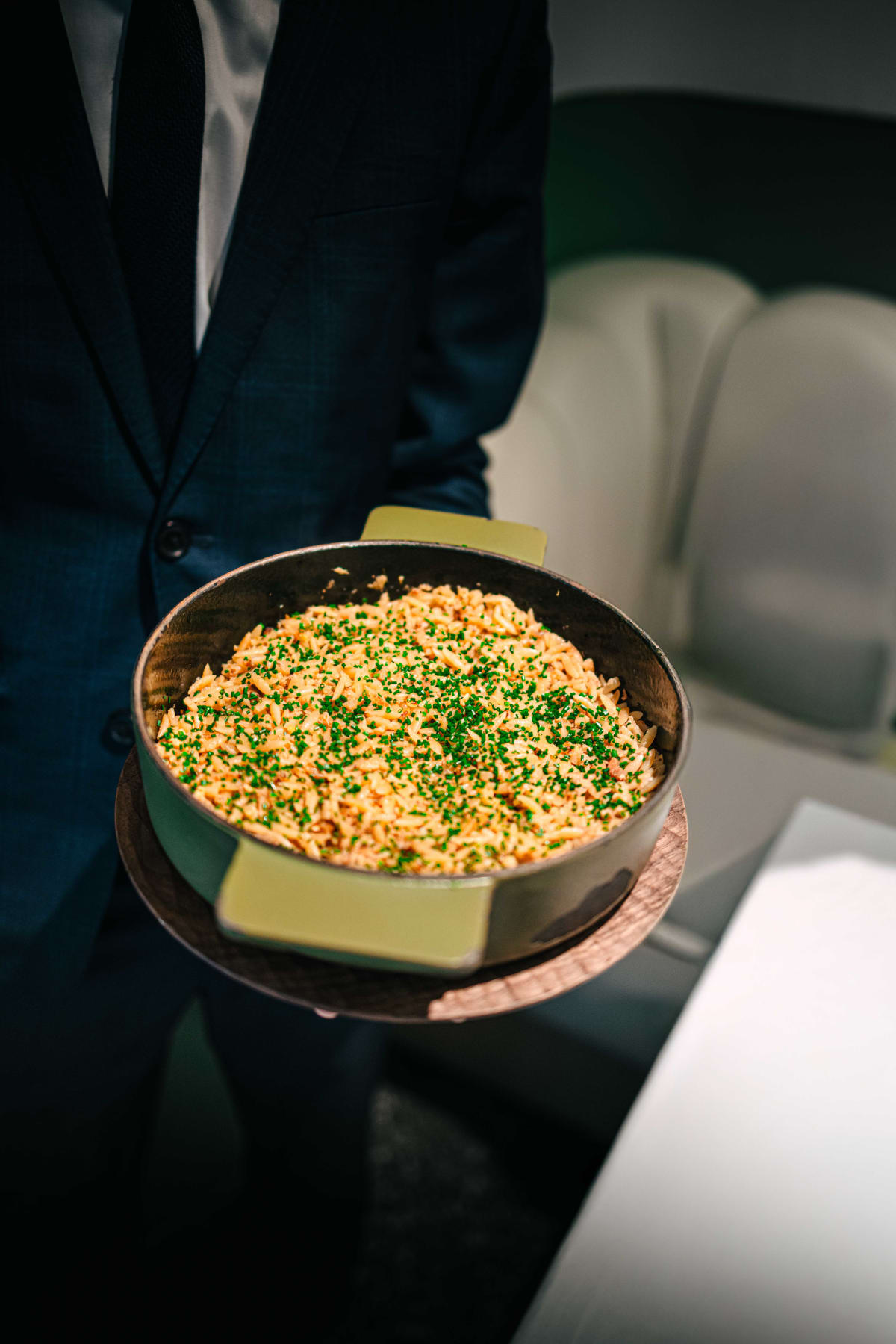 JEE, Hong Kong: the orzo brought to the table in its pan, scattered with chives