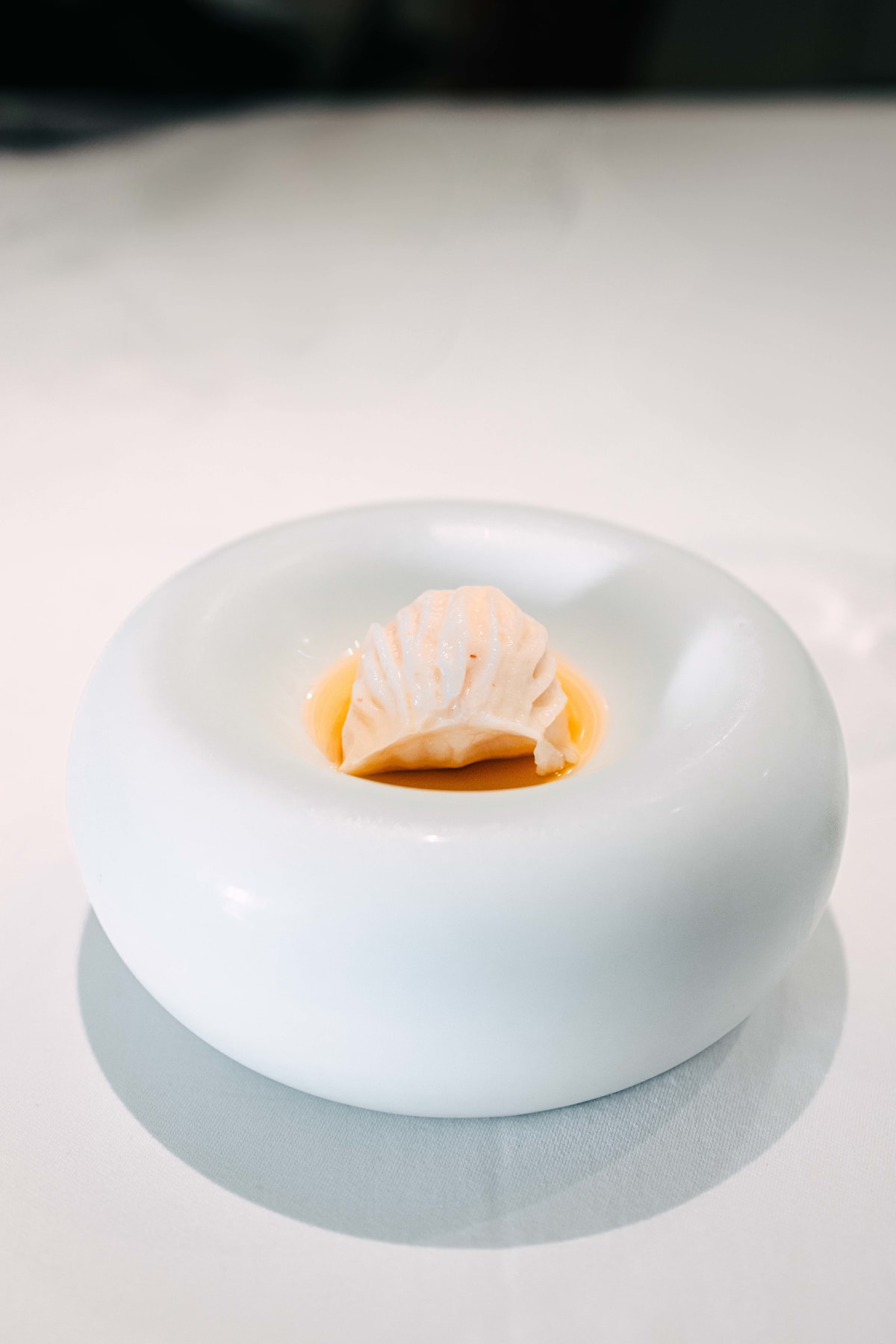 JEE, Hong Kong: the lychee dessert shaped like a pleated dumpling, in a round white bowl