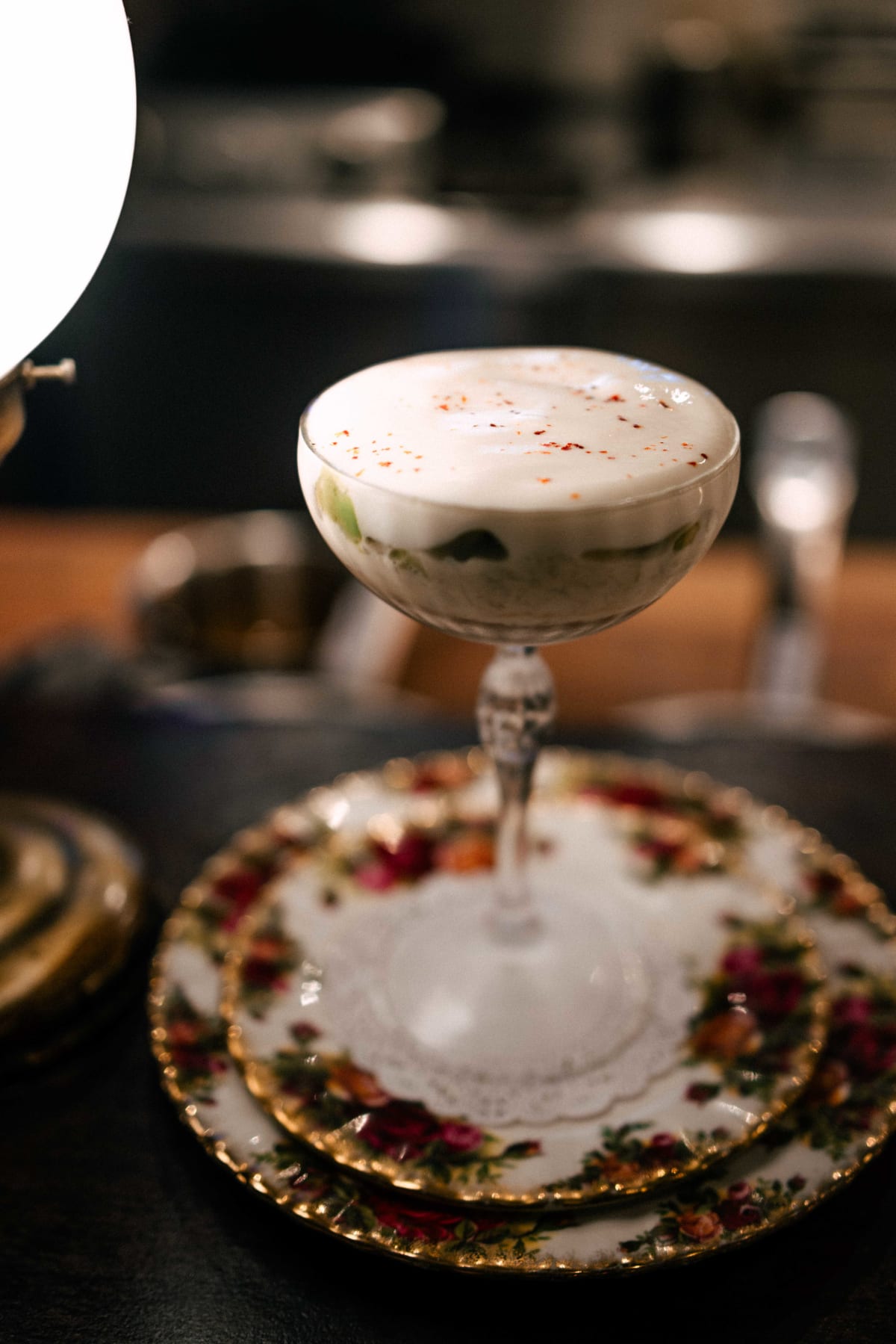 Bistro de la Mer, Amsterdam: the brown crab cocktail in a coupe on stacked rose-patterned plates