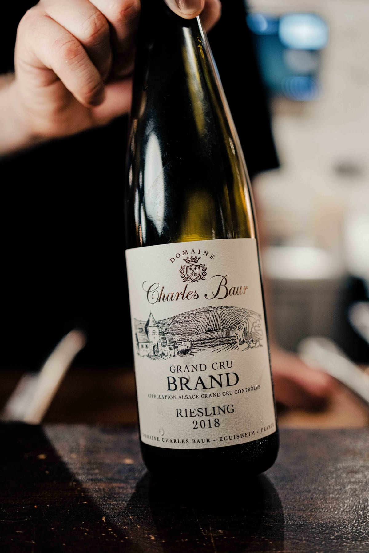 Bistro de la Mer, Amsterdam: a bottle of Charles Baur Grand Cru Brand Riesling 2018, with a dragon on the label