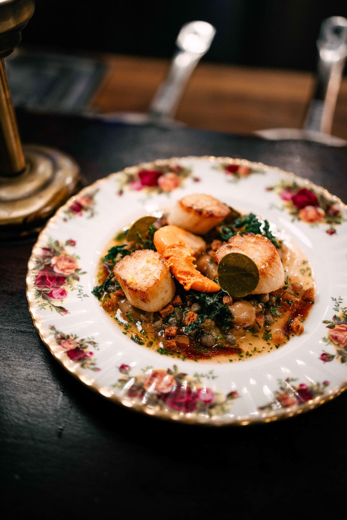 Bistro de la Mer, Amsterdam: pan-fried scallops à la grenobloise with veal jus on a rose-patterned plate