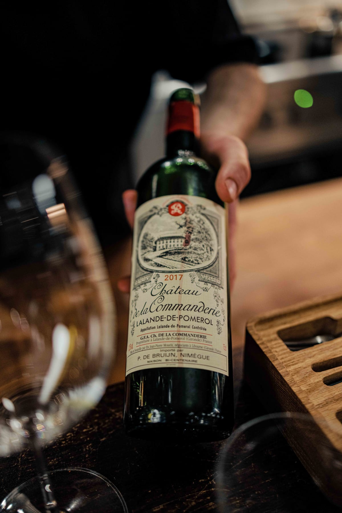 Bistro de la Mer, Amsterdam: a bottle of Château de la Commanderie 2017, with the P. de Bruijn import label