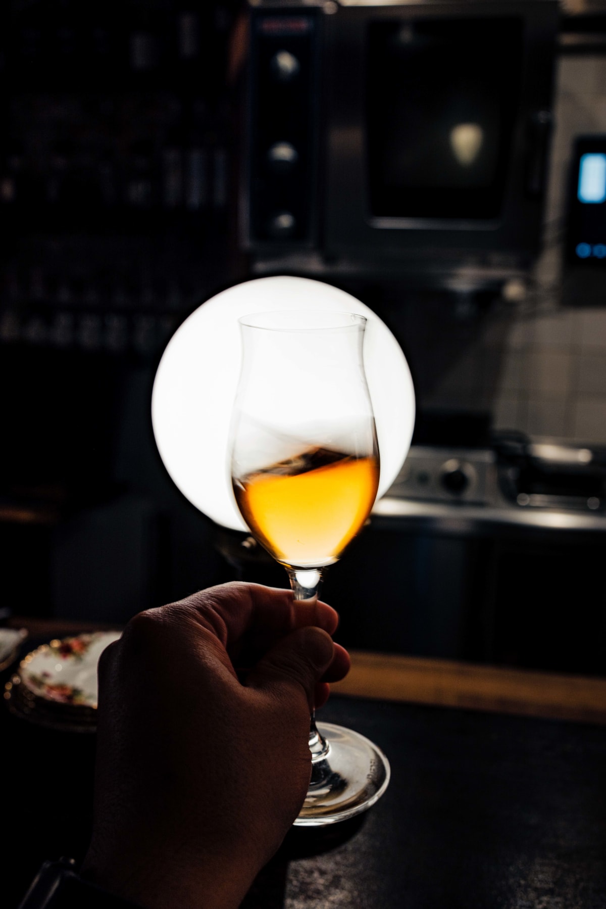 Bistro de la Mer, Amsterdam: the Zantho swirled in the glass, the kitchen behind