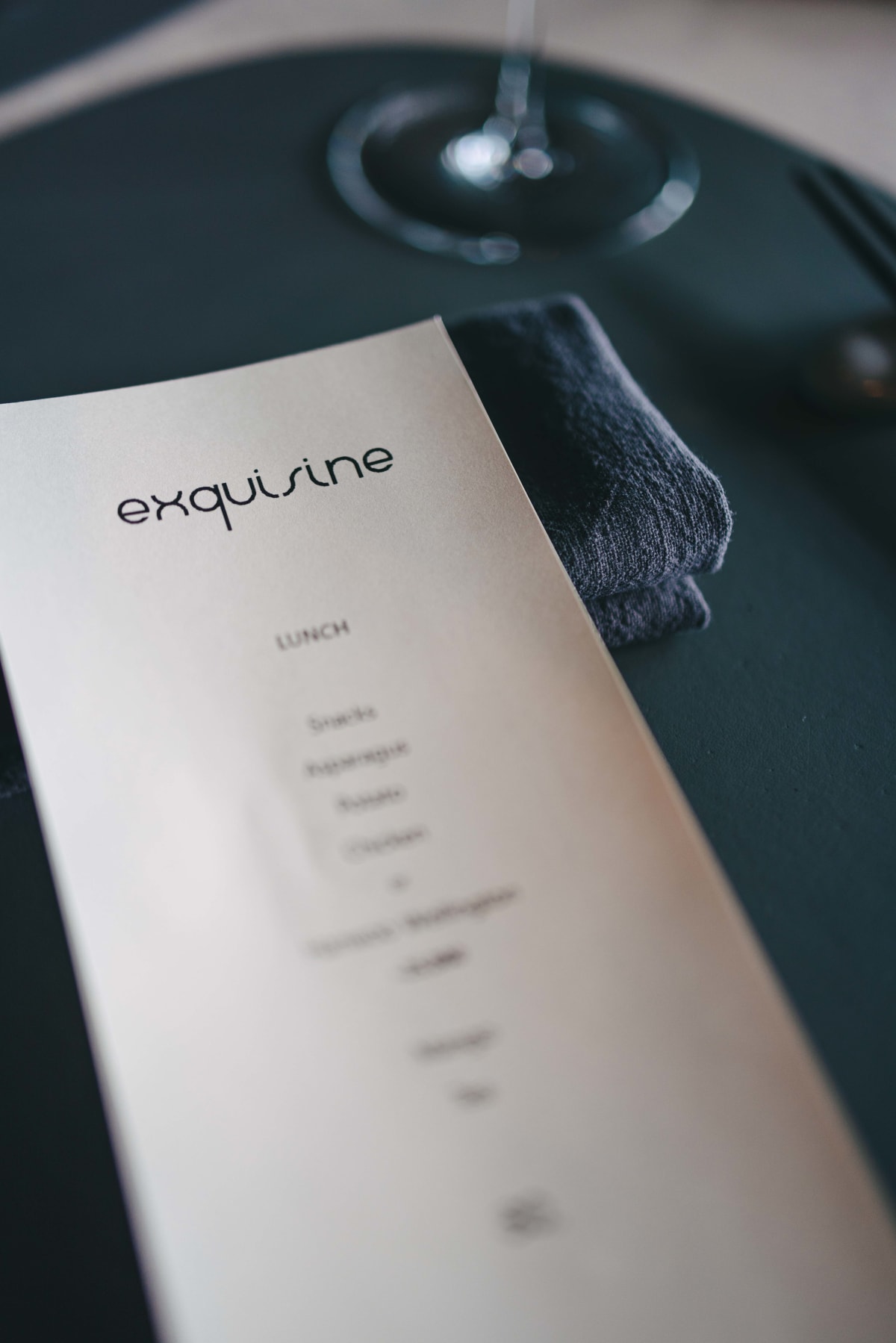 Exquisine, Seoul: the lunch menu card on a dark napkin