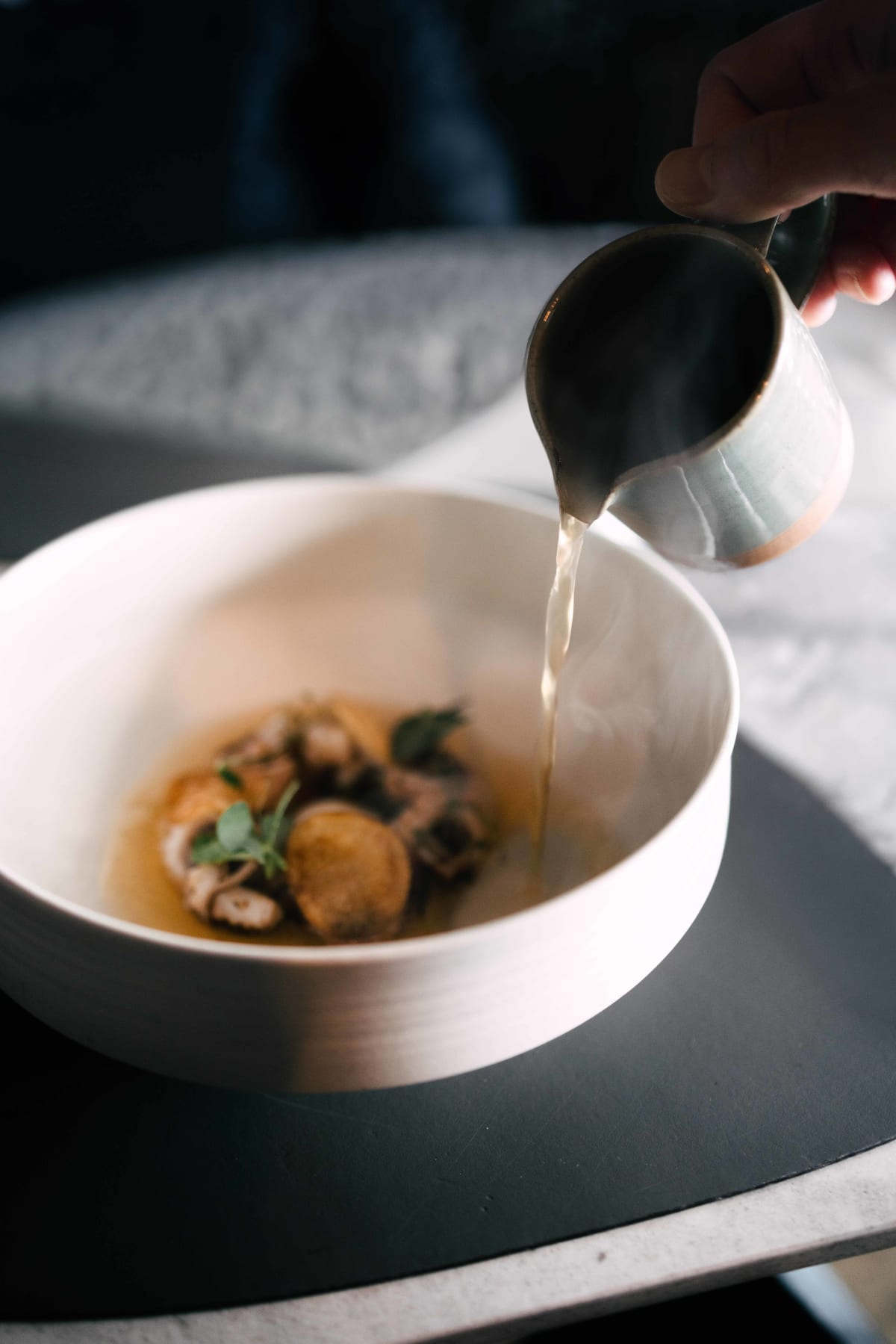 Exquisine, Seoul: the broth poured from a small jug over the octopus and potato crisps