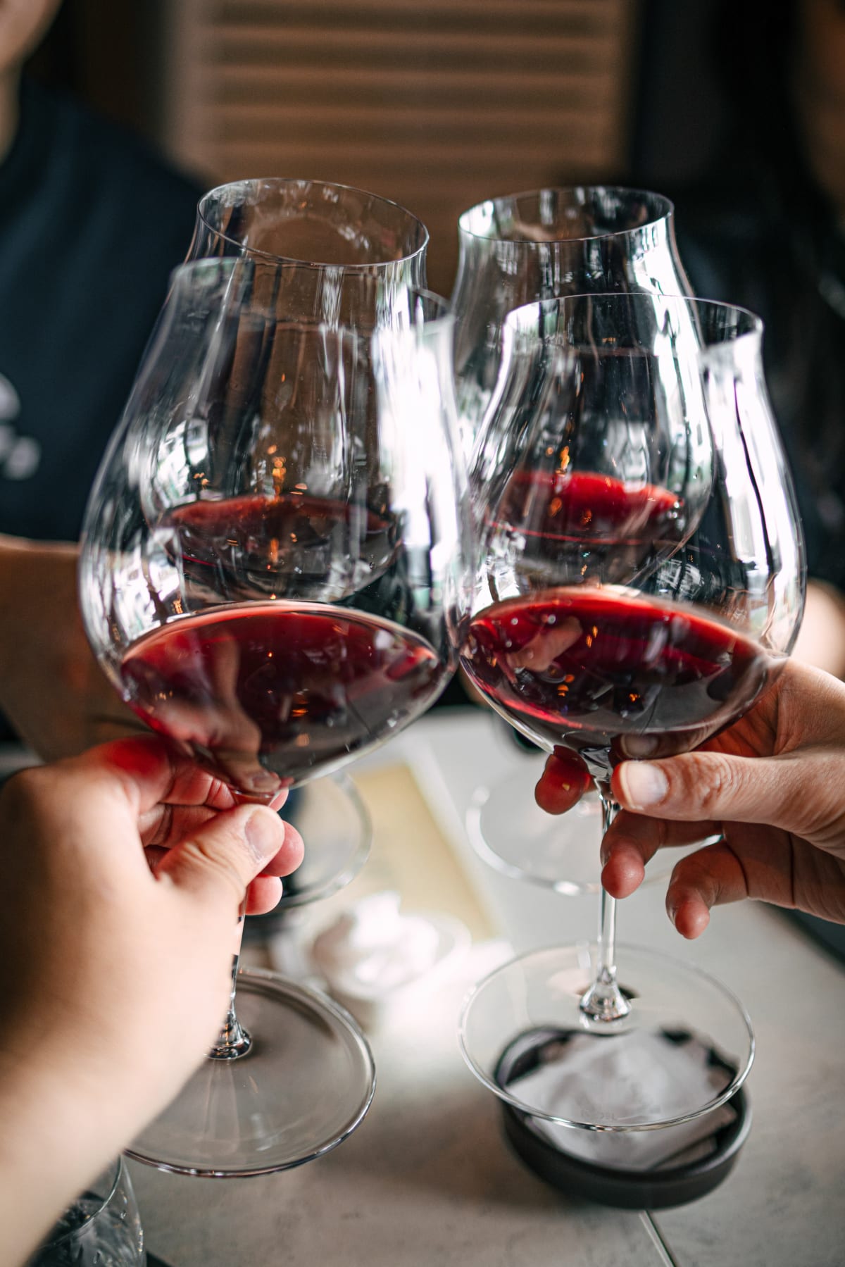 Exquisine, Seoul: three glasses of the wine raised in a toast