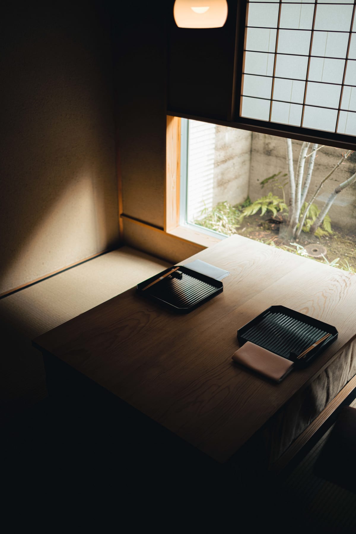 Matsukawa, Tokyo: the private room laid for two, daylight falling across the table from the garden window