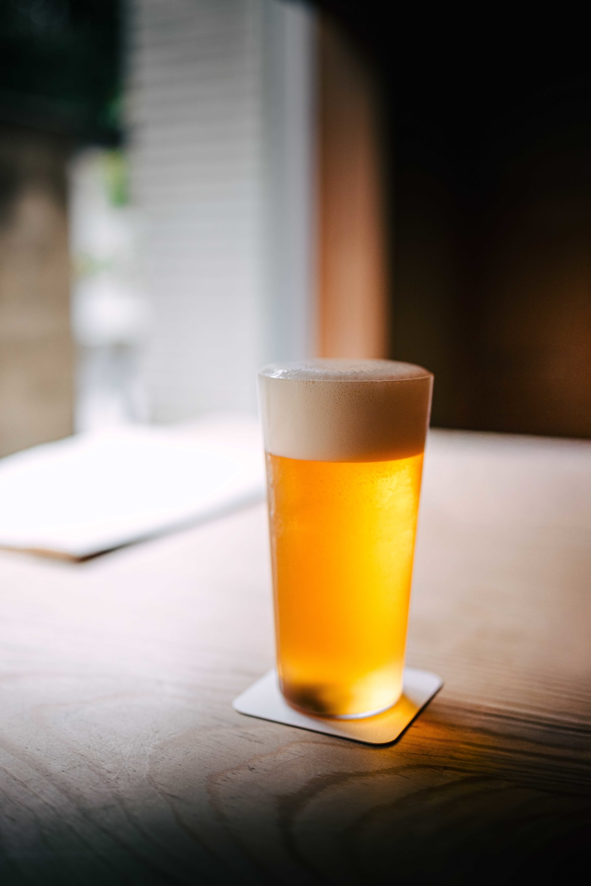 Matsukawa, Tokyo: a glass of draft beer to start, by the window